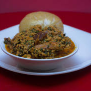 Eba With Egusi Soup And Goat Meat