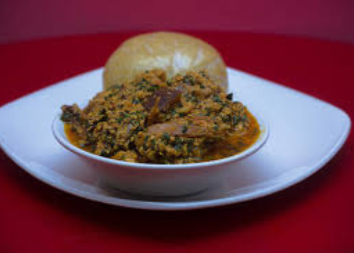 Eba With Egusi Soup And Goat Meat